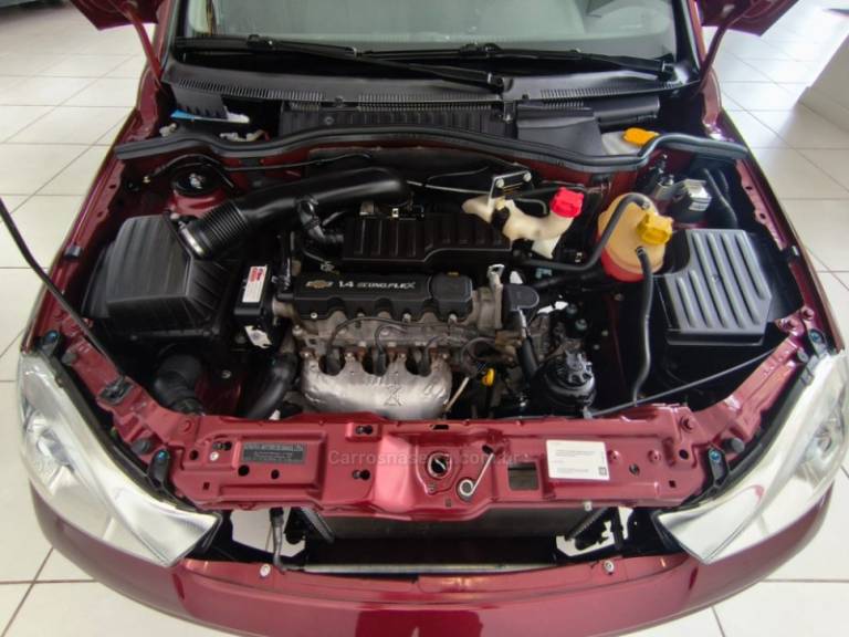 CHEVROLET - CORSA - 2010/2011 - Vinho - R$ 39.900,00